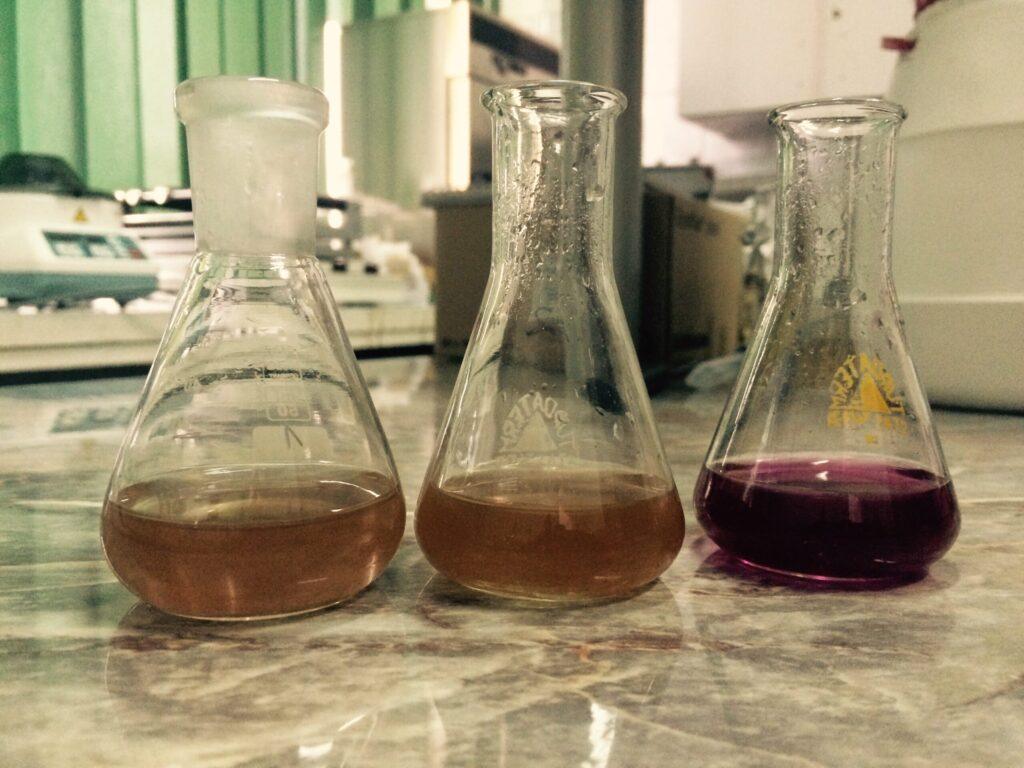Laboratory setup performing a basic chemical assay in glassware