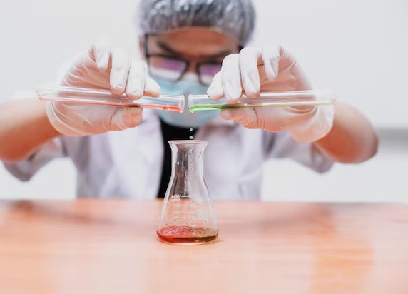 Scientist handling chemical samples during residual solvent analysis
